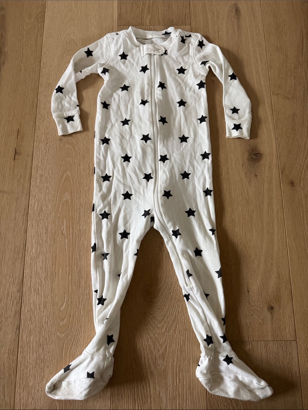Primary White Footed One-Piece with Black Star Print